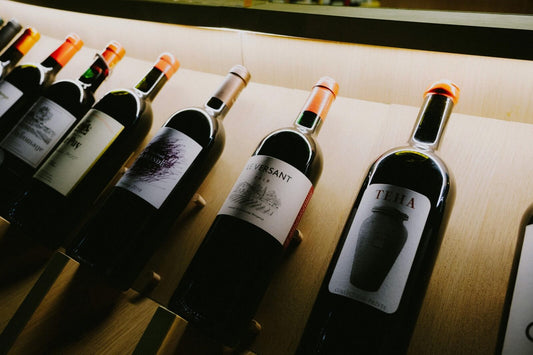 Wine bottles against a wooden surface